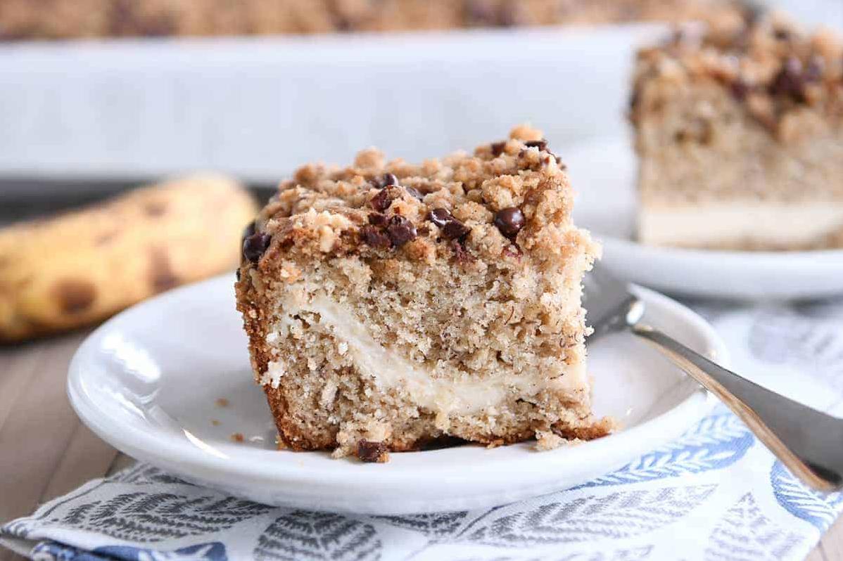  Get ready to swoon over this amazing coffee cake – it's stuffed with the creamiest of cream cheese, mouth-watering chocolate chips, and of course, loads of ripe bananas!