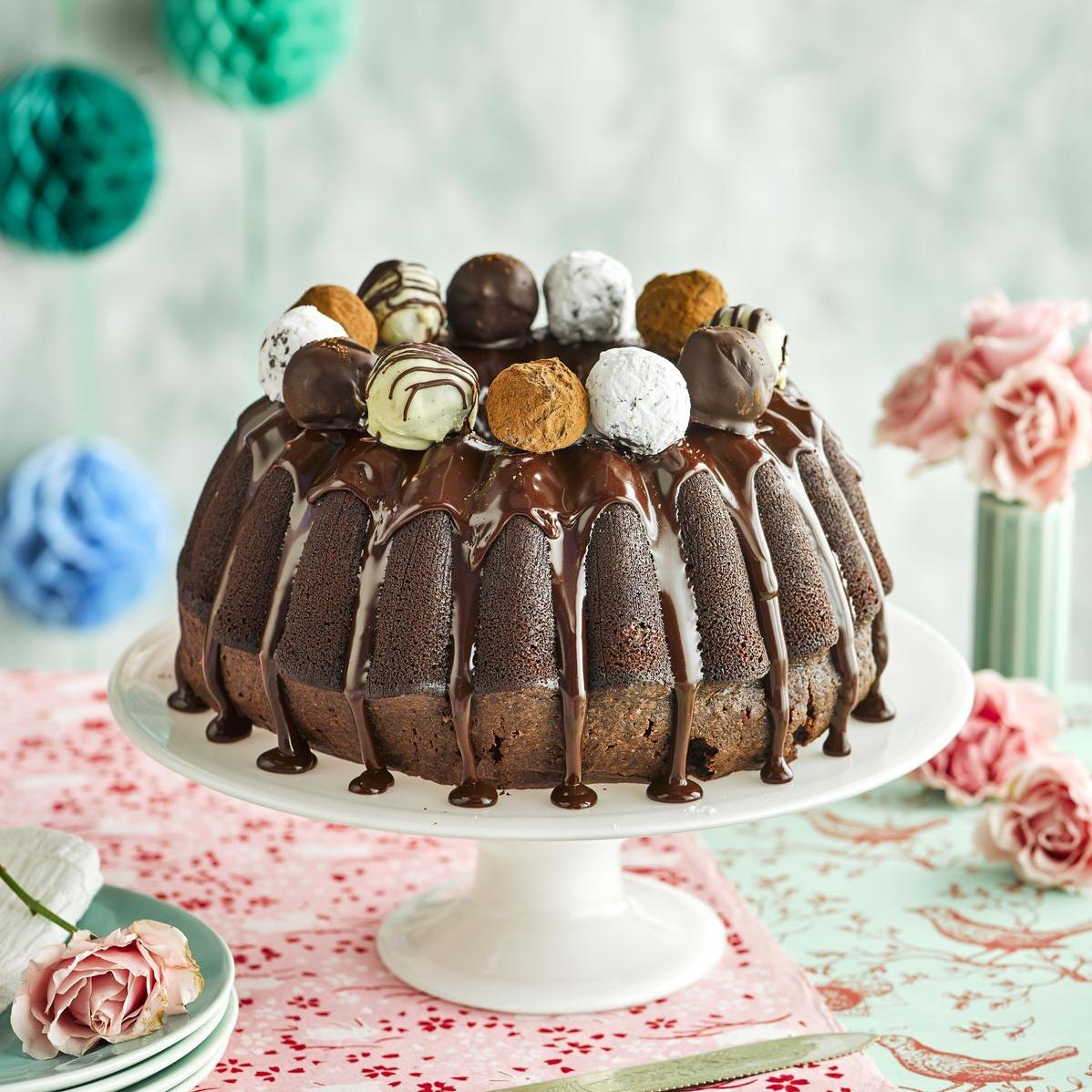  The glossy chocolate ganache on top adds an extra layer of indulgence to this cake.